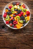 Fruit fresh mixed tropical fruit salad. Bowl of healthy fresh fruit salad - died and fitness concept. photo