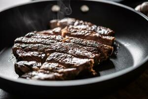 Fat unhealthy grilled beef strak in teflon pan photo