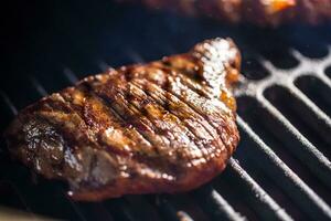 Close-up Beef flank steak cooking on grill photo