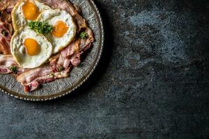Top of view roasted bacon and egg with herbs. photo
