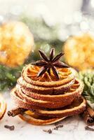 Dried orange in the shape of a Christmas tree and star anise on top photo