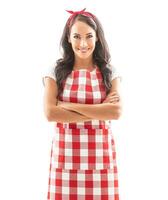 Beautiful housekeeper on isolated background, smiling with arms crossed on her chest photo