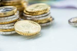 Towers with euro coins stacked together - close-up photo