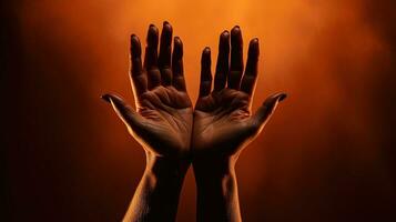 Crucifix resting on brown surface held by female hands. silhouette concept photo