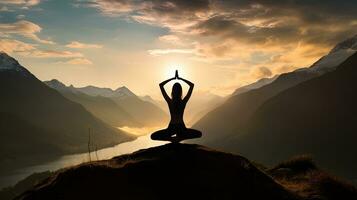 Yoga in the outdoors amidst mountain landscapes. silhouette concept photo