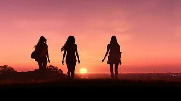 Three friends walk in a park at sunset today. silhouette concept photo