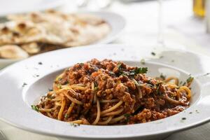 Traditional Italian spaghetti bolognese served in a plate photo