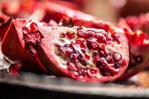 Pomegranate. Pieces of frest pomegranate on plate photo
