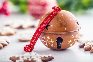 Jingle bell gingerbread cinnamon star anise on table photo