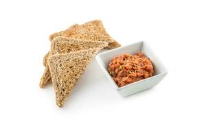 Tuna cereamy tartare with toast breads isolated on white photo