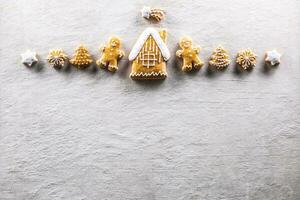 Christmas gingerbread cookies, house, man, tree and snowflakes - copy space photo