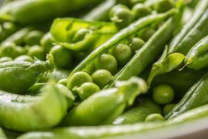 Fresh green pea seeds and pods - Close up photo