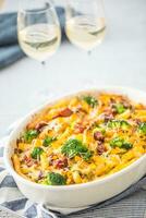 Baked pasta penne with broccoli smoked pork neck mozzarela cheese and othe ingredients photo