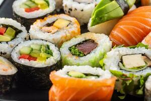 Assortment of japanese sushi rolls nigiri sashimi and maki photo