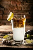 Dark n Stormy highball cocktail served as a long drink with rum, fresh lime juice, and ginger beer photo