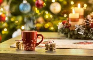 Christmas coffee and advent wreath on table with boheh lights in background photo