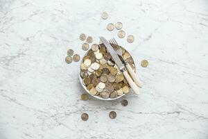 Top of view full plate of euro coins on marble table photo