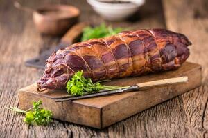 Pork meat.Pork chop smoked. Traditional smoked meat on oak wooden table in other positions photo