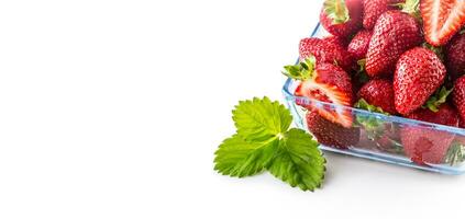 Fresh ripe strawberry in glass bowl isolated on white photo