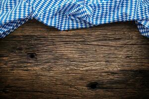 Oktoberfest. The blue checkered tablecloth or napkin typical of the Munich Beer Festival in the German Oktoberfest. Free space for your text product or information photo