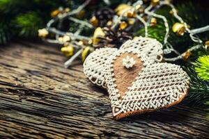 Christmas cake ginderbread. Christmas hearts cakes and decoration on rustic oak table photo