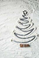 Shaped christmas tree of flour star and cinnamon. photo