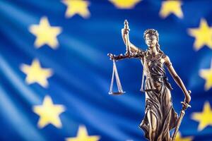 Lady Justice and European Union flag. Symbol of law and justice with EU Flag photo