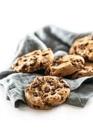 Cookies with chocolate pieces isolated on white background photo