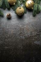 Top of view christmas balls fir tree pine cones on free concrete background photo