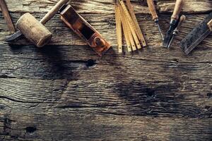 Top of view vintage carpenter tools in a carpentry workshop photo