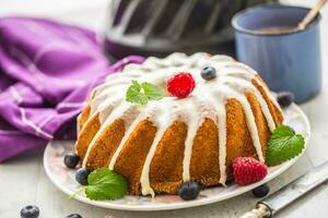 Easter Cake. Traditional ring marble cake withe easter decotation. Easter eggs and spring tulips. photo