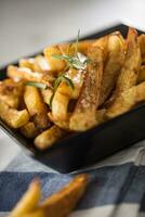 Potato Fries. Homemade potato fries with salt and rosemary photo