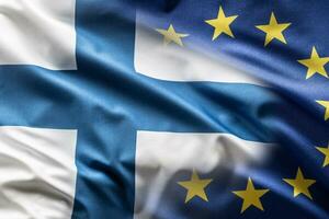 Flags of Finland and EU blowing in the wind photo