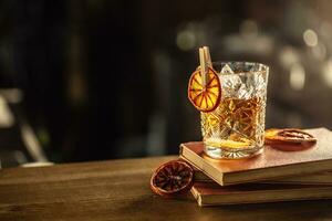 Glass cup with Old Fashioned cocktail in retro style photo