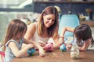 Happy Family mom daughter save money piggy bank future investment savings photo