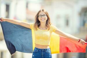 Attractive happy young girl with the Belgian flag photo