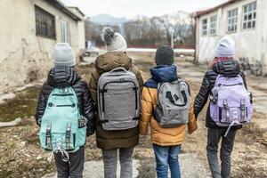 Vysne Nemecke, Slovakia. March 09. 2022. Woman flees the conflict with Russia with three kids in a derelict surroundings photo