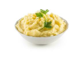 Mashed potatoes in bowl isolated on white. photo