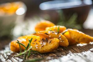 Potatoes. Roasted american potatoes with rosemary salt and cumin photo