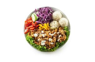 Chicken kebab with fresh vegetable, fries and rice isolated on white background photo