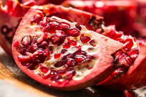 Pomegranate. Pieces of frest pomegranate on plate photo