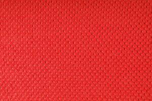 Bright red knitwear wool fabric texture background. Abstract textile backdrop photo