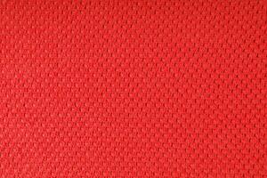 Bright red knitwear wool fabric texture background. Abstract textile backdrop photo