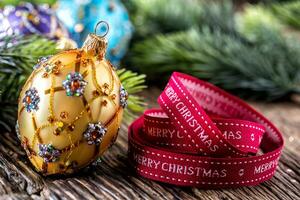 Christmas Time. Luxury golden purple blue christmas ball and decoration.Red ribbon with text happy christmas photo