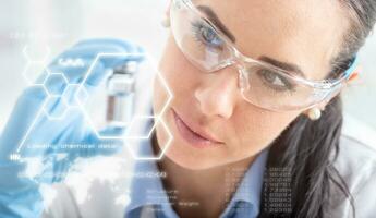 A young scientist examines a chemical substance. In front futuristic scientific interface with chemical formulas photo