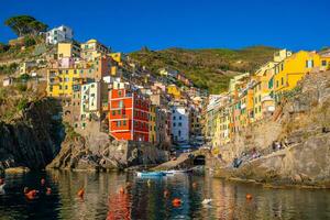 Colorful cityscape of buildings over Mediterranean sea, Europe, Cinque Terre in Italy photo