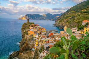 Colorful cityscape of buildings over Mediterranean sea, Europe, Cinque Terre in Italy photo