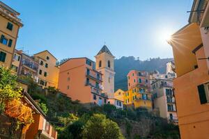 Colorful cityscape of buildings over Mediterranean sea, Europe, Cinque Terre in Italy photo