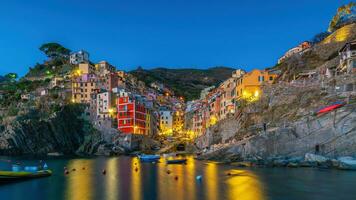 Colorful cityscape of buildings over Mediterranean sea, Europe, Cinque Terre in Italy photo