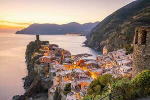 Colorful cityscape of buildings over Mediterranean sea, Europe, Cinque Terre in Italy photo